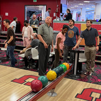 UIT employees bowl September 1, 2022, at the A. Ray Olpin Union bowling alley.