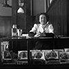 From the William Edward Hook glass negatives collection: “Cigar store woman at counter.” Image courtesy of J. Willard Marriott Library.