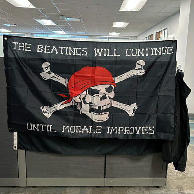 Employees hung a large flag that reads, “The beatings will continue until morale improves” for International Talk Like a Pirate Day on September 19.