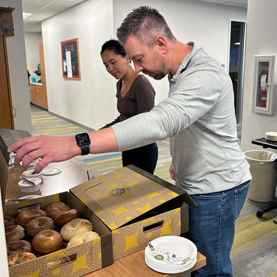 Employees select a bagel during breakfast on International Talk Like a Pirate Day on September 19.