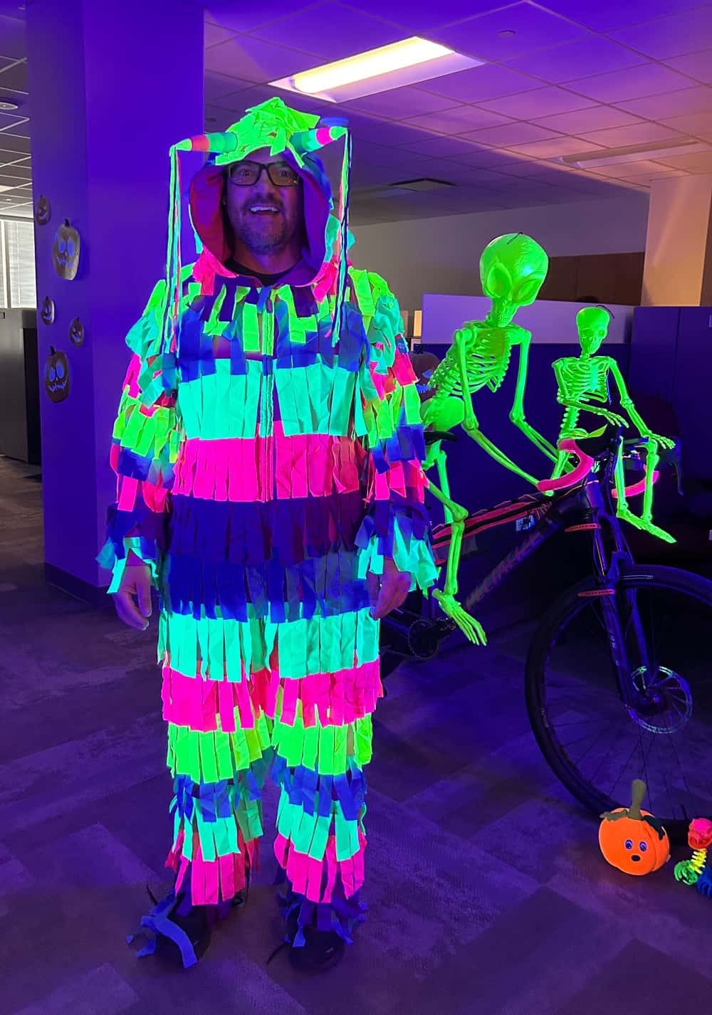 Data Management & Analytics (DMA) Director Brian Harris, dressed as a “Pedaling Piñata,” won best costume, while DMA won best decorated area with “Haunted Pumpkin Patch.” (Courtesy of Abbey Allen)