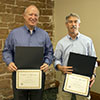 Celebrating 25 years of service, from left: James Morris and Ray Daurelle.
