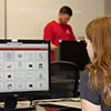 University of Utah student Jacqueline Mumford tests the new CIS portal on Thursday, May 25, 2017. In the background is UX Developer Geoff Anderson.