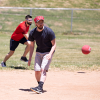 Dan Gillen (USS), foreground, plays kickball. (Photo by Thanh Nguyen)