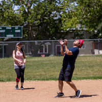 Reza Sarijlou (USS), foreground right, and Barb Iannucci (USS) play kickball. (Photo by Thanh Nguyen)