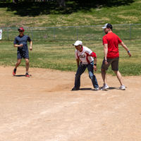 Jeff Shuckra (DCIO), from left, Ray Lacanienta (USS), and Stephan Stankovic (SPS) play kickball. (Photo by Thanh Nguyen) 