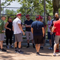 Players from USS and UIT SPS teams gather near the fence at Lindsey Garden Park. (Photo by Thanh Nguyen) 