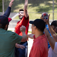 Software Platform Services staff cheer during the UIT SPS and USS kickball game.