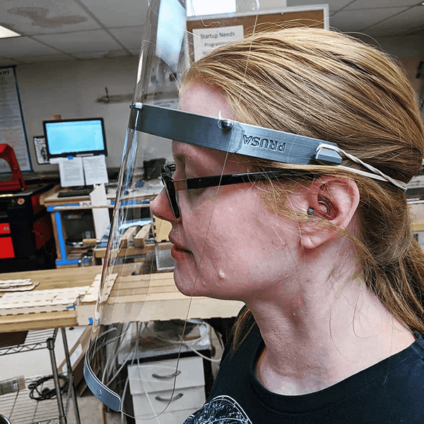 Beth Sallay models a face shield that her team 3D printed and laser cut at Make Salt Lake as part of its COVID-19 PPE project. (Courtesy of Beth Sallay)
