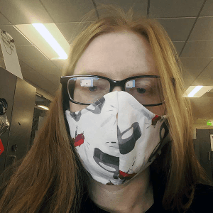 Beth Sallay wears a face mask she sewed from MacGyver fabric. (Courtesy of Beth Sallay)