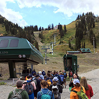 Volunteers line up at the ski lift.