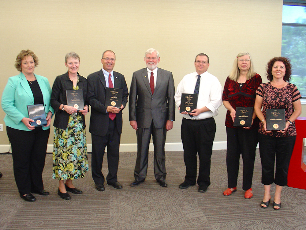 2013 university-level award winners with President David Pershing, center.