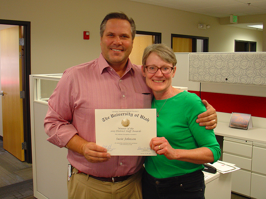 Chief Human Resources Officer Jeff Herring with Susie Johnson, a 2013 district award winner